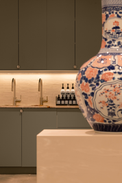 Decorative vase with cabinets and products on a counter