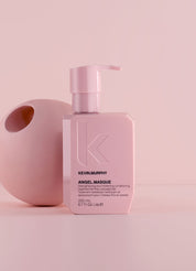 Kevin Murphy Angel Masque bottle on a pink background