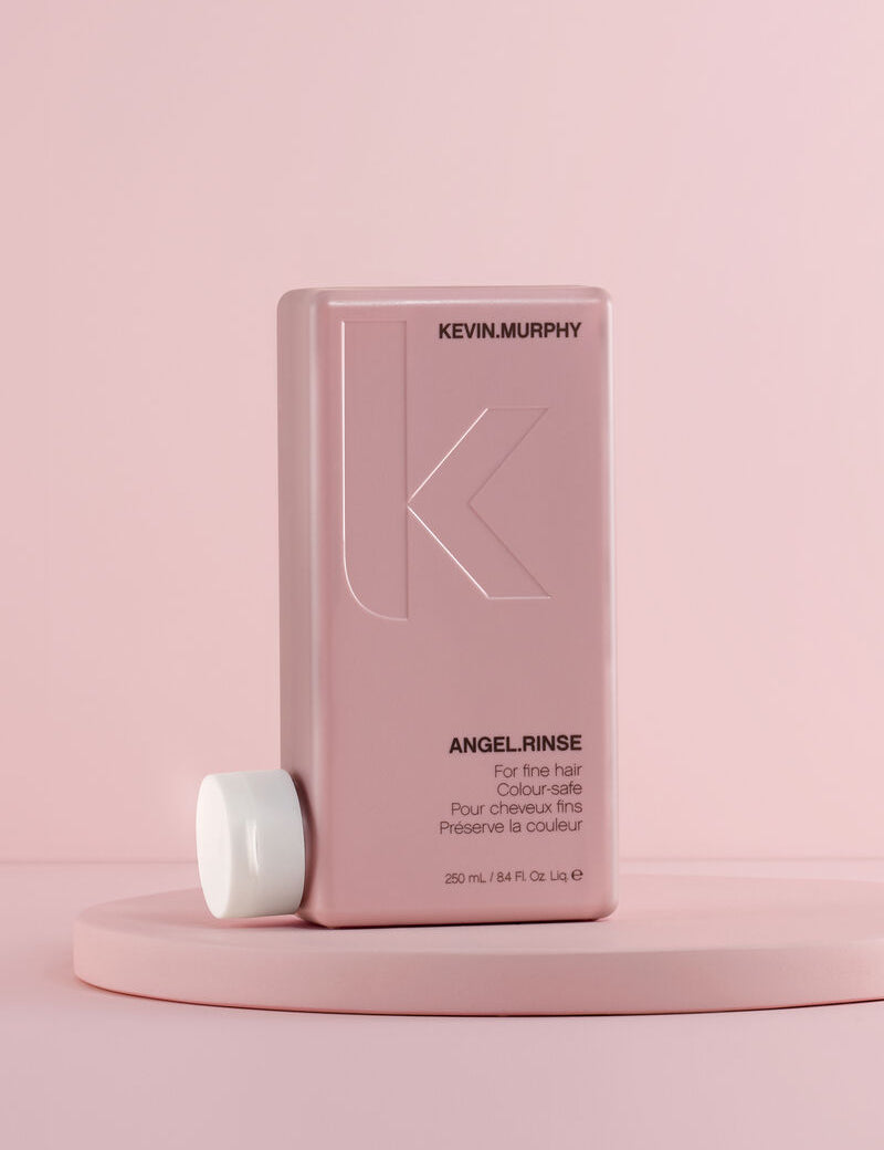 Kevin Murphy Angel Rinse bottle on a pink background