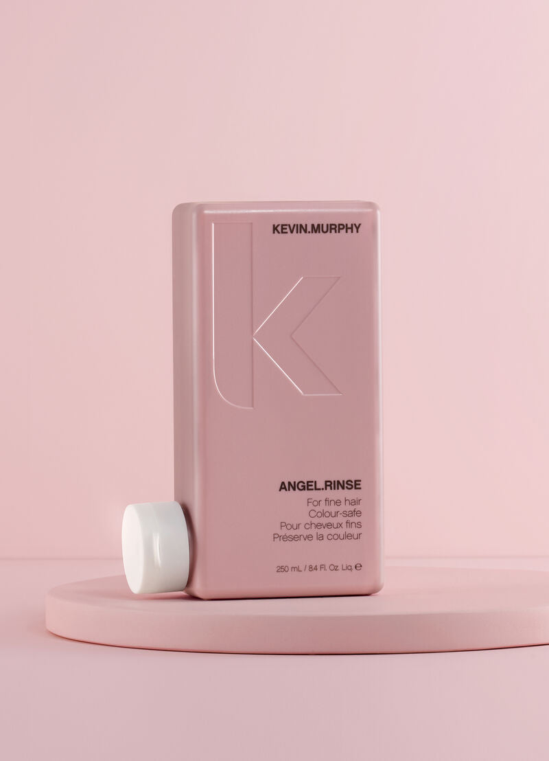 Kevin Murphy Angel Rinse bottle on a pink background