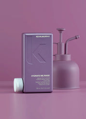 Kevin Murphy Hydrate Me Rinse bottle and pump on a pink background