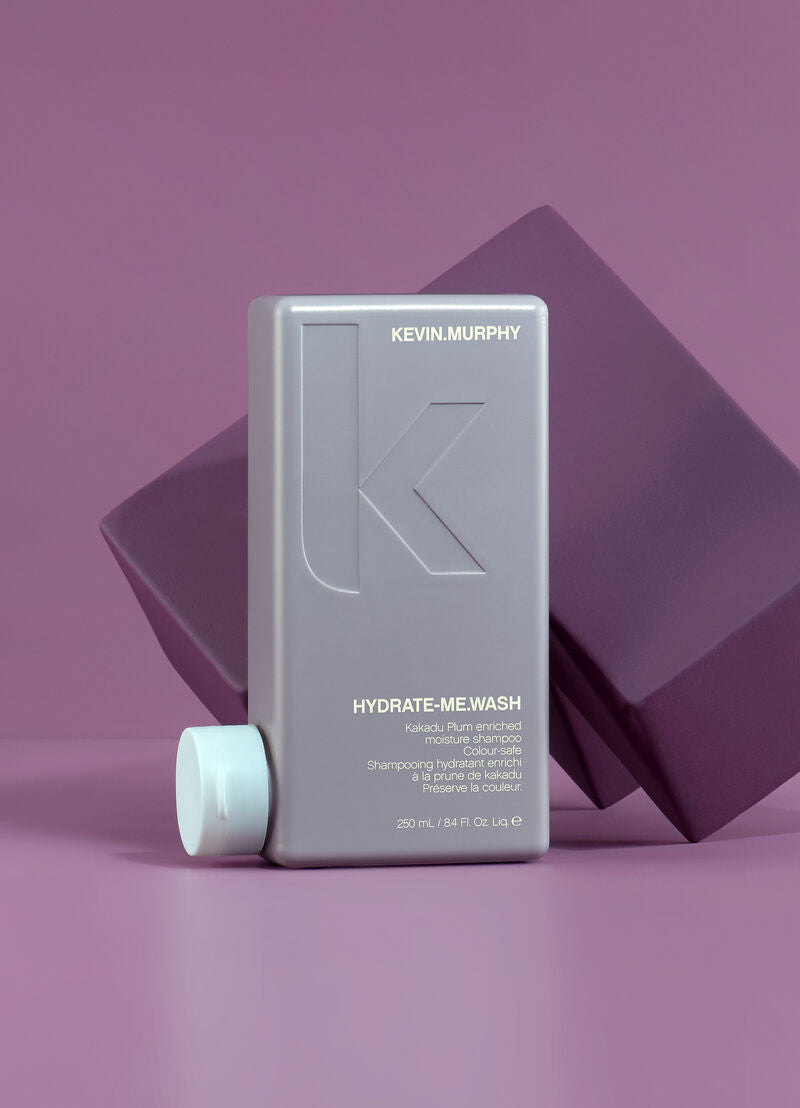 Kevin Murphy shampoo bottle on a purple background