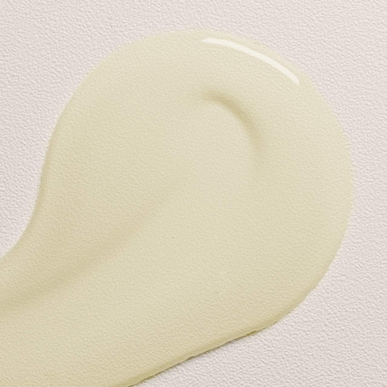 a sample of oi hair oil on a white background