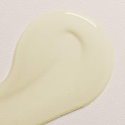 a sample of oi hair oil on a white background