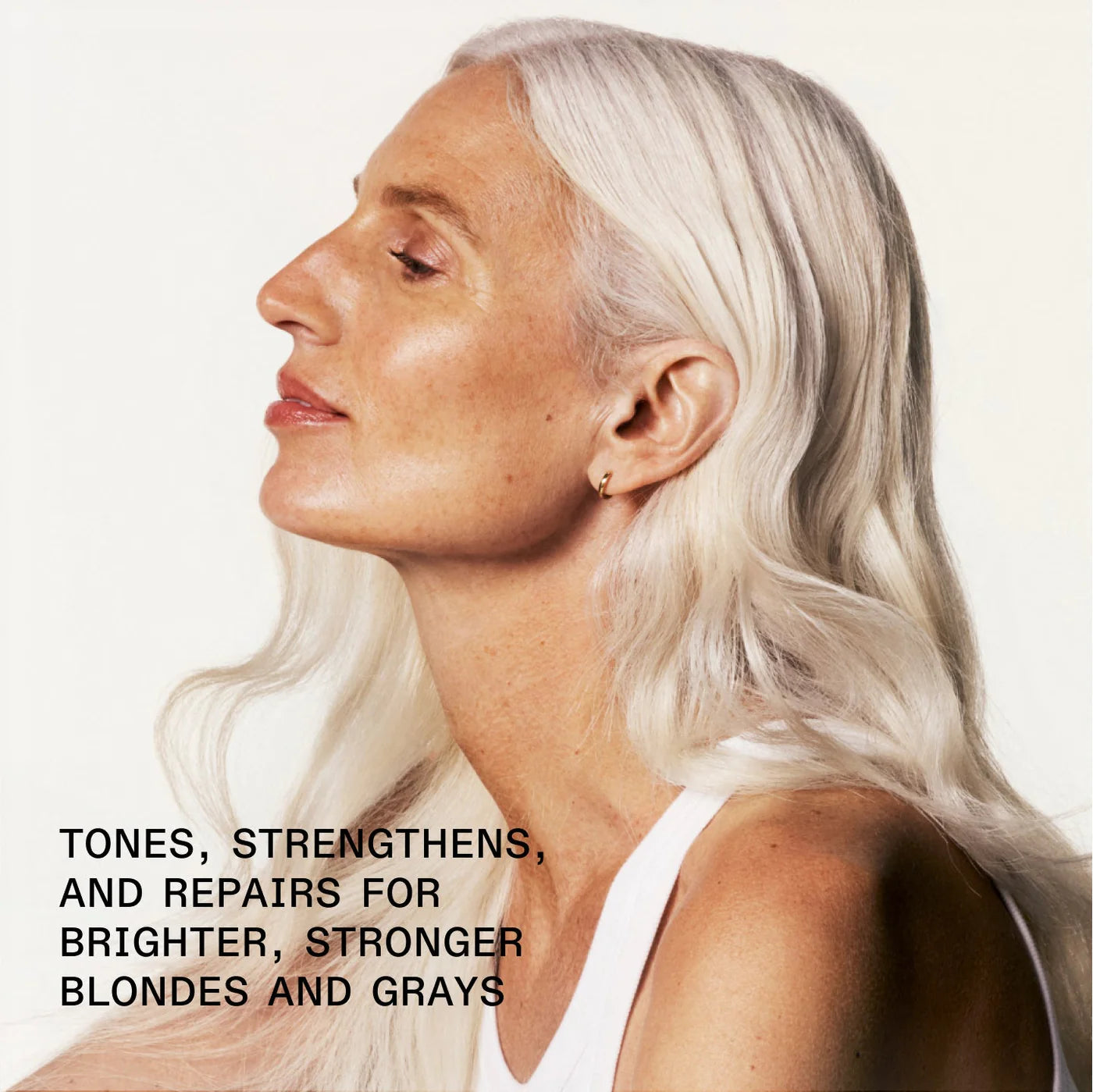 Woman with white hair against a plain background with text about hair care.