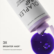 OLAPLEX hair product with purple liquid being poured out on a white background