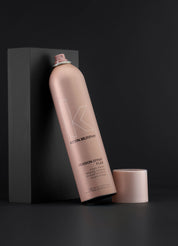 Kevin Murphy hair spray bottle on a black background