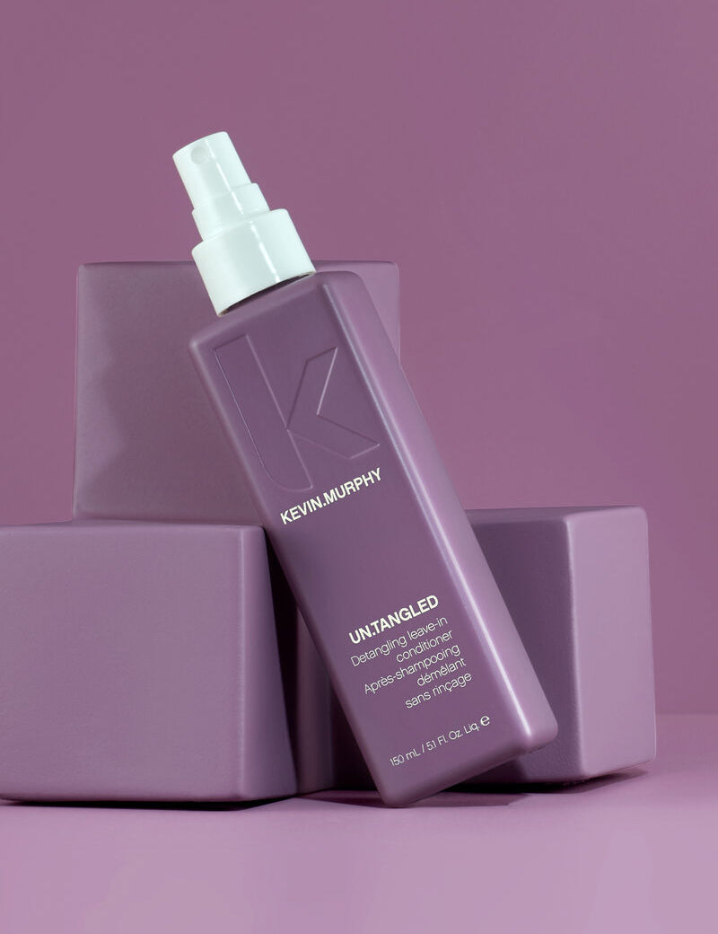 Kevin Murphy hair product bottle on a purple background