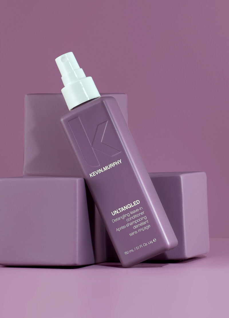 Kevin Murphy hair product bottle on a purple background