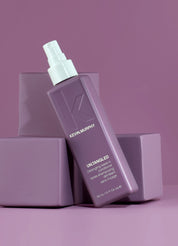 Kevin Murphy hair product bottle on a purple background