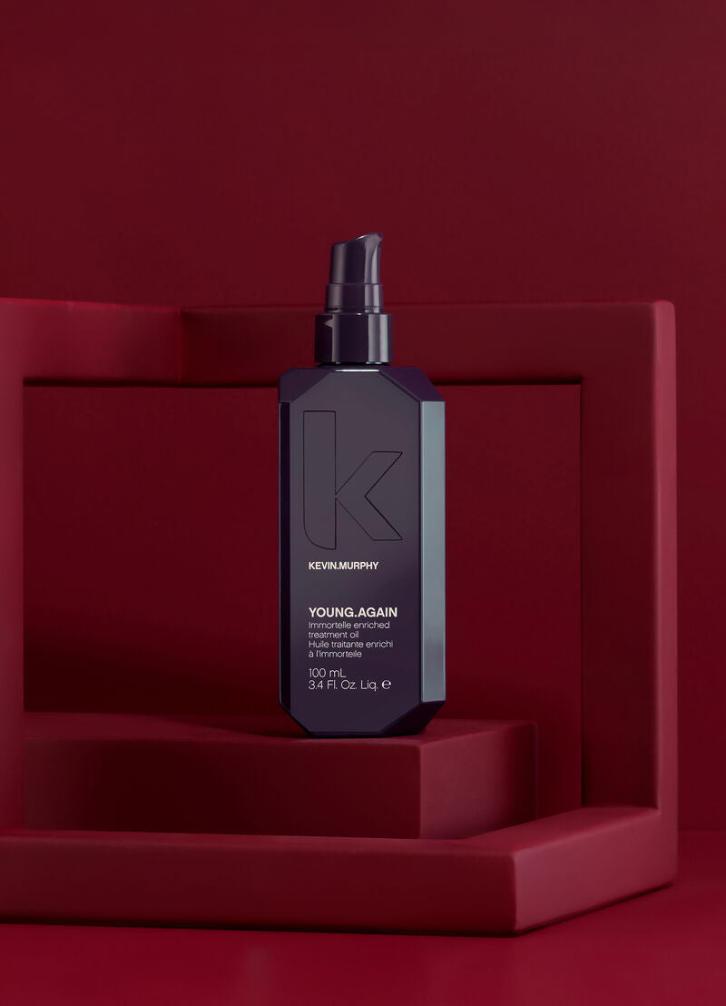 Kevyn Murphy young again hair product bottle on a red background