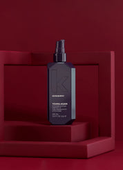 Kevyn Murphy young again hair product bottle on a red background