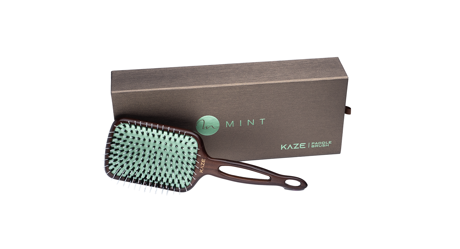 Hairbrush with green bristles and handle on a white background