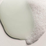 momo shampoo sample on a light gray background